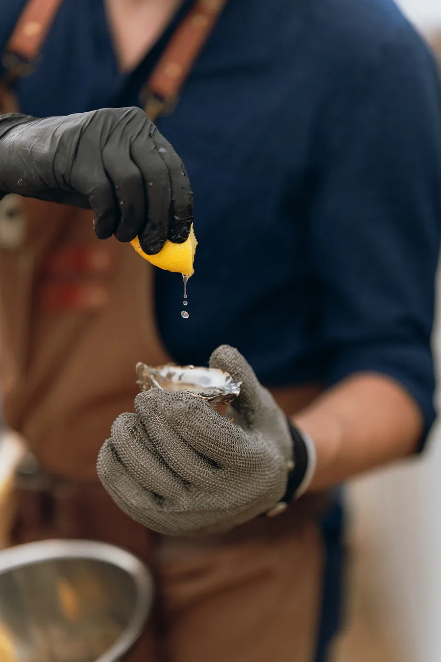 Lemon squeezed over a freshly shucked oyster