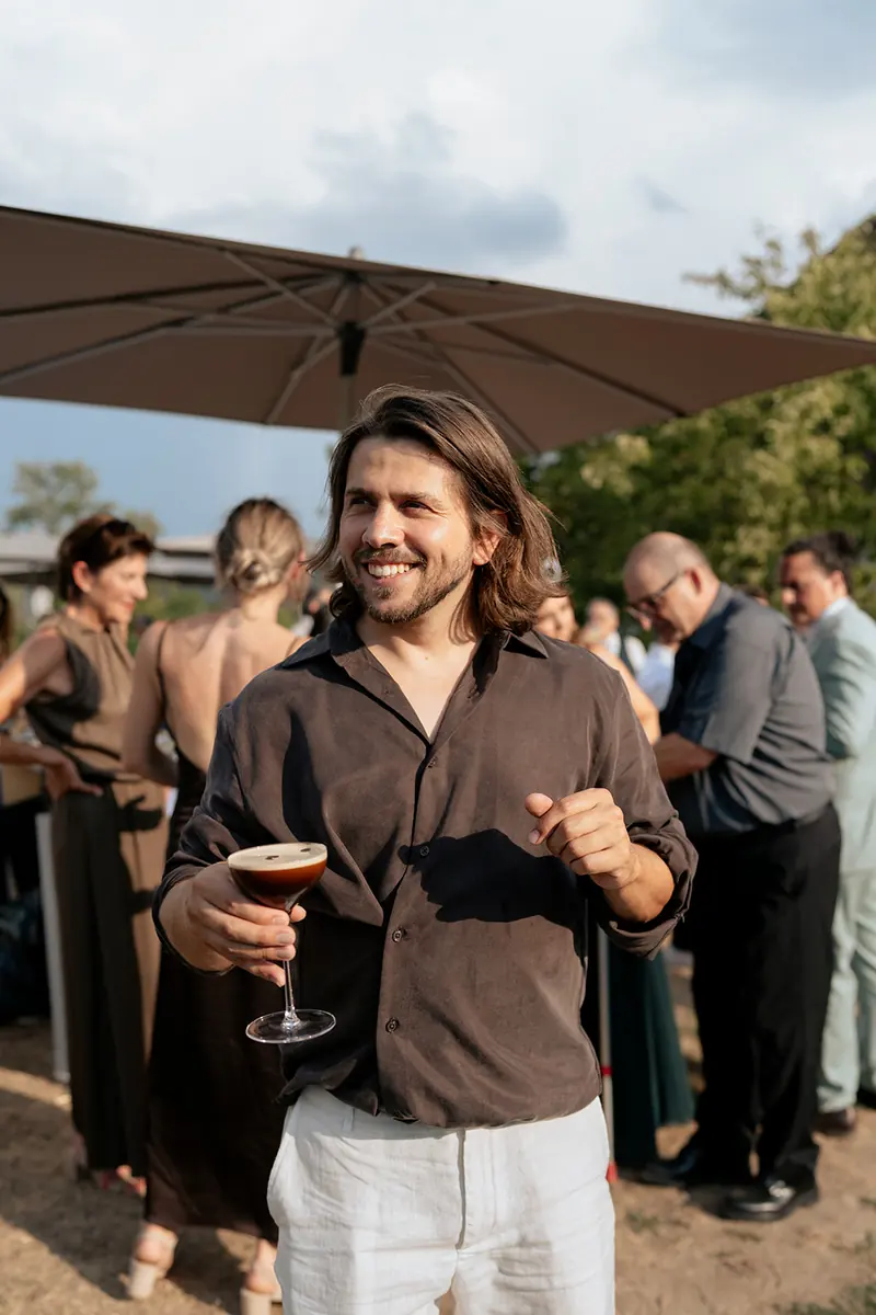 Guest with an espresso martini at a private party